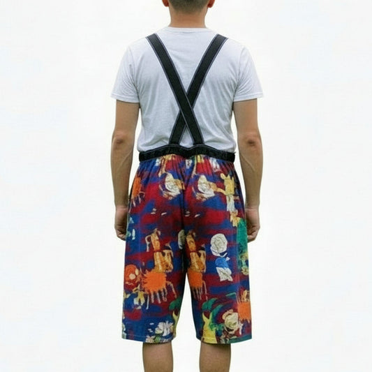Colorful overalls with suspenders on a guy in the park playing on a swing
