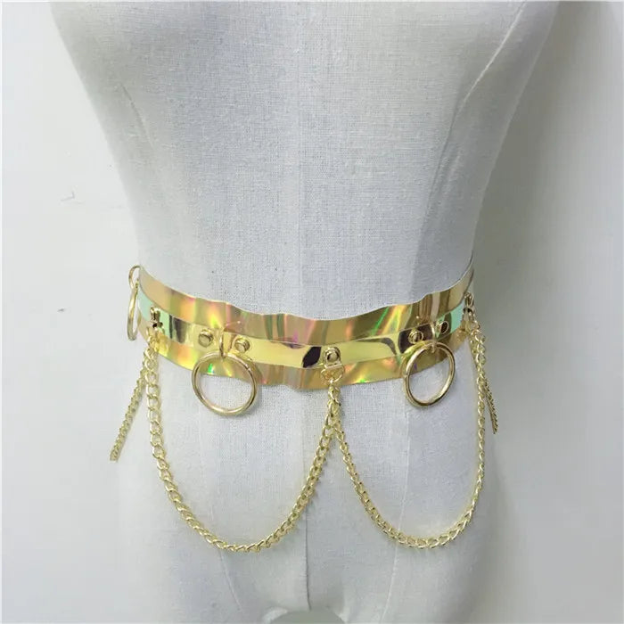 Gold metallic belt with chain details on a mannequin against a white background
