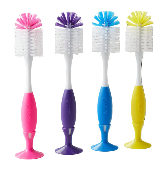 Four colorful bottle brushes with different colored handles on a white background