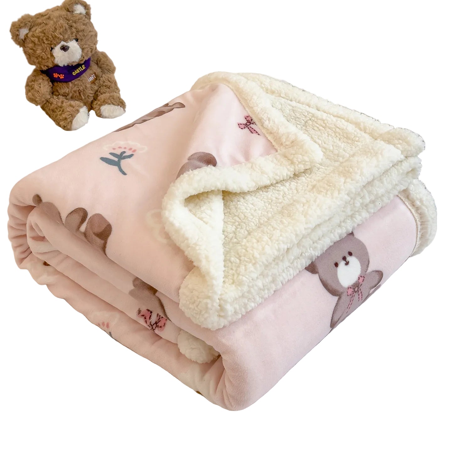 Pink blanket with teddy bear design on a bed