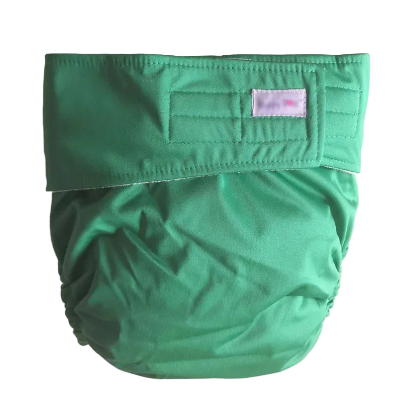 Green cloth diaper on a beige background