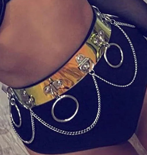 Black lace bra and blue underwear with decorative chains on a textured background