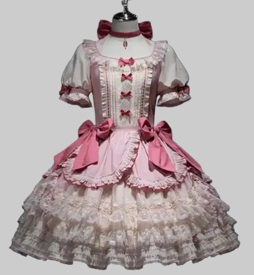 Lace dress with pink bows on a mannequin against a black background, branded 'Irelia H Store'.