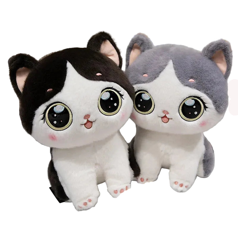Two plush cat toys with a bowl of cat food on a white surface.