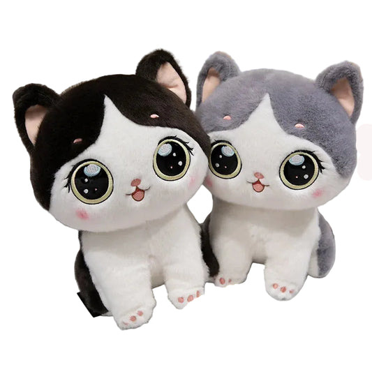 Two plush cat toys with a bowl of cat food on a white surface.