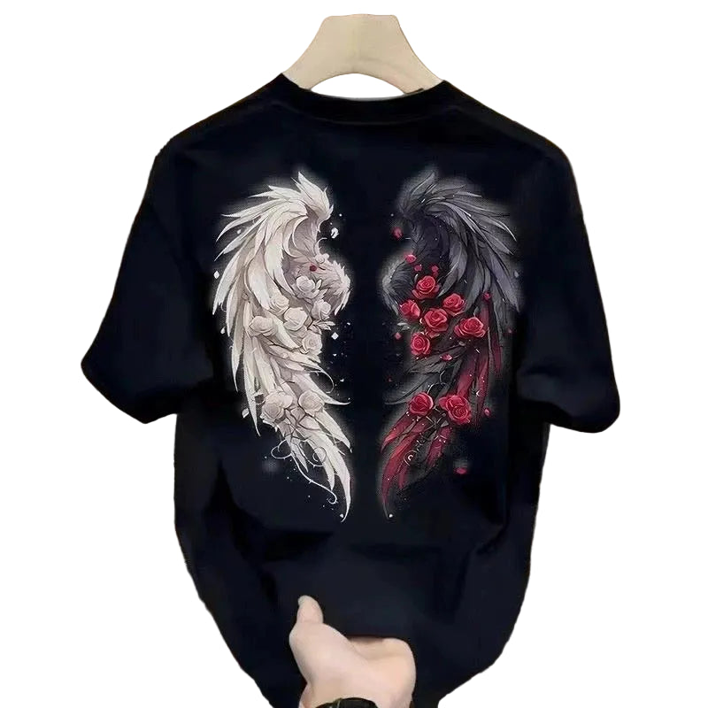Black t-shirt with a phoenix and floral design on a hanger in a luxurious interior setting.