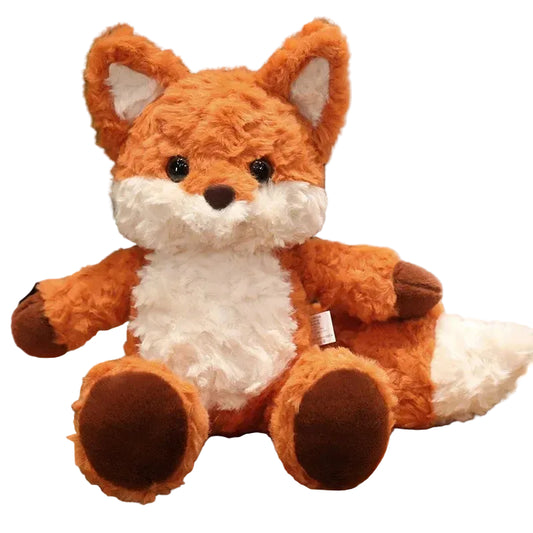 Plush fox toy on a wooden surface with a blurred background