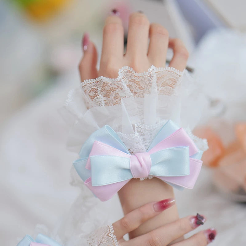 Lace glove with a colorful bow on a blurred background