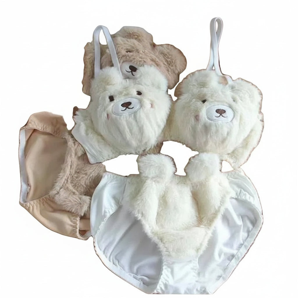Fluffy white and brown teddy bear-shaped baby lingerie on a white background.