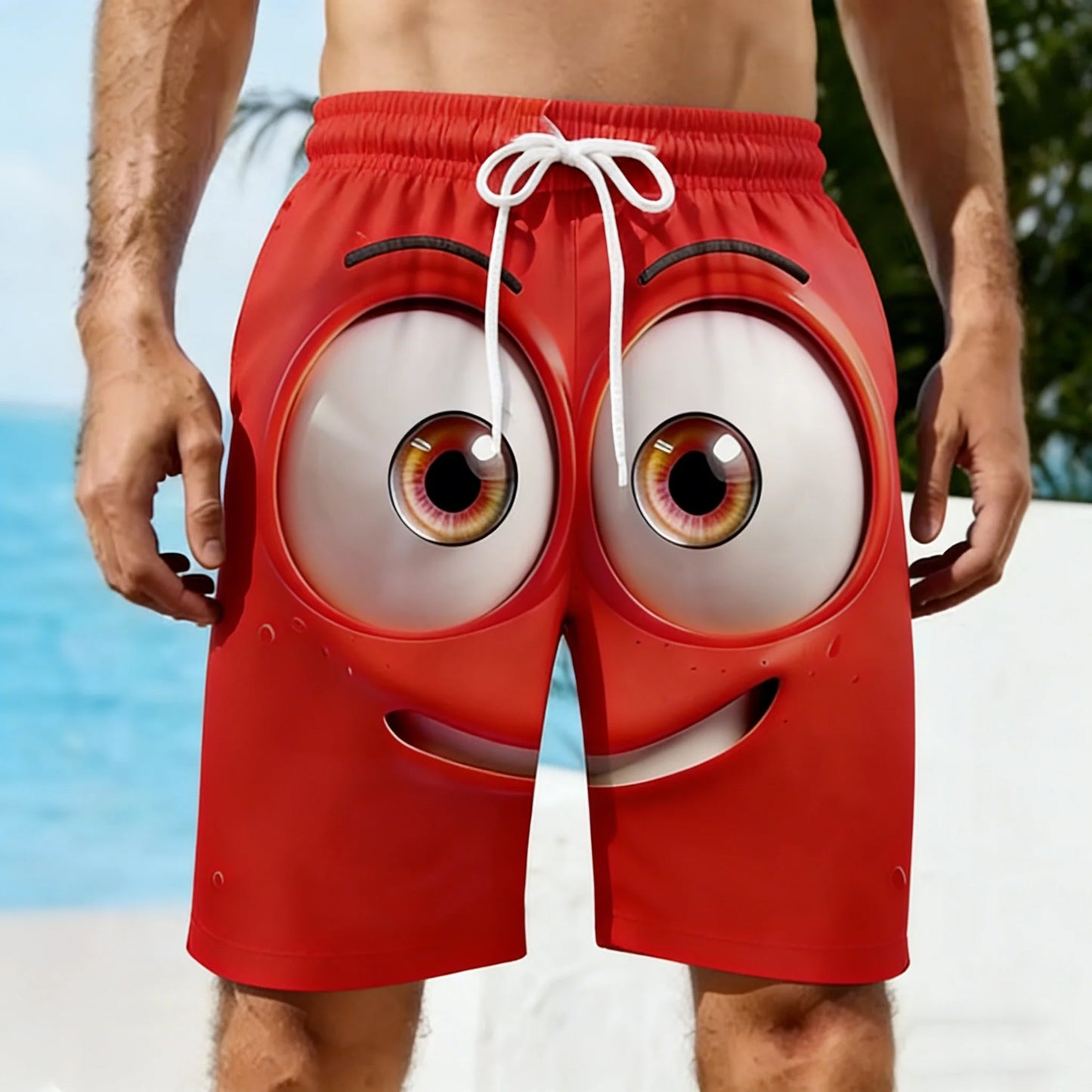 Red shorts with cartoonish eyes and mouth on a beach