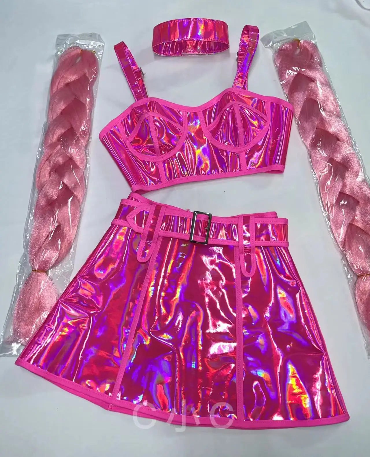 Pink holographic outfit with bra, skirt, and headband on a white background