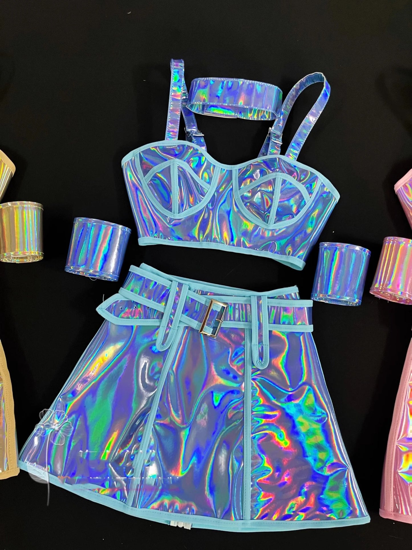 Holographic outfit with bra and skirt on a black background