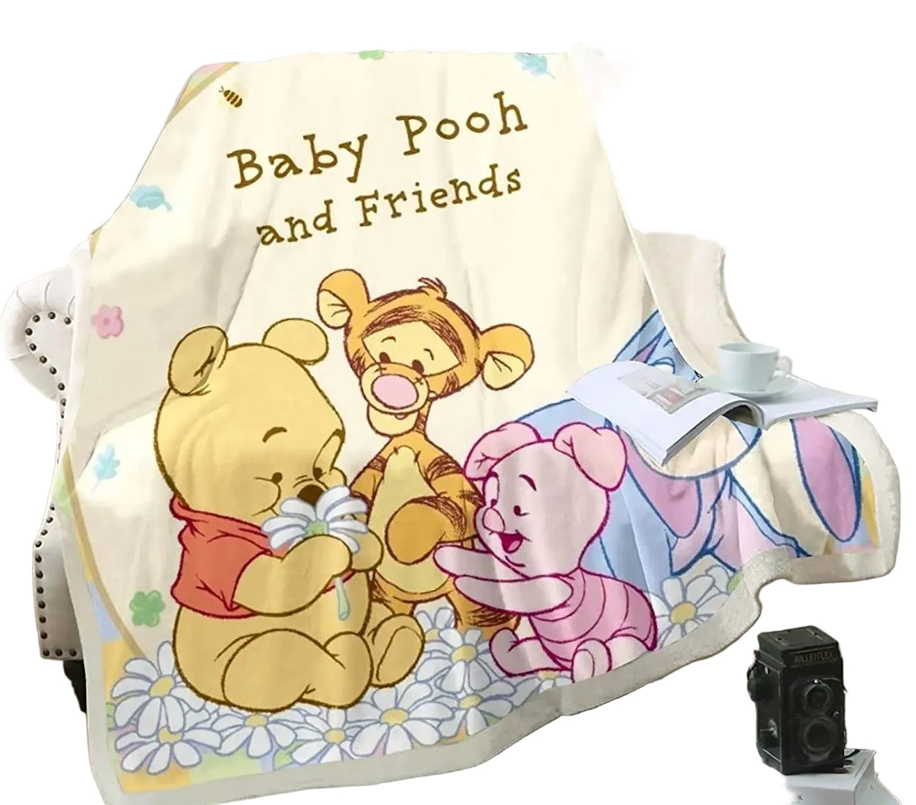 Blanket with cartoon characters on a couch in a living room setting