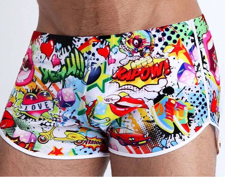 Colorful graphic shorts with a comic book style design on a plain background