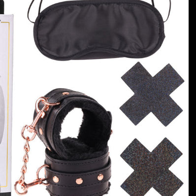 Sex and Mischief brat kit with blindfold, handcuffs, and other accessories on a white background