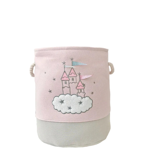 Pink storage basket with castle design on a white surface