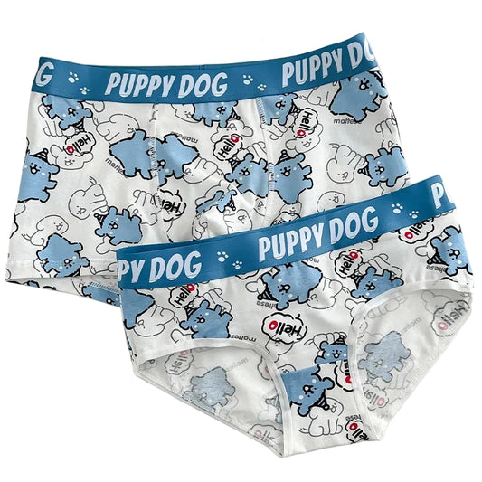 Pair of children's underwear with blue 'Puppy Dog' waistband on a white surface.