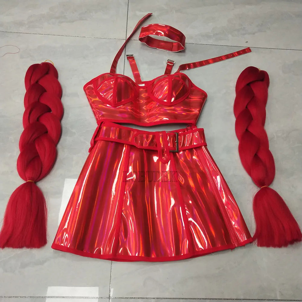 Red shiny dress set with bra, belt, and red braided hair extensions on a light gray floor.