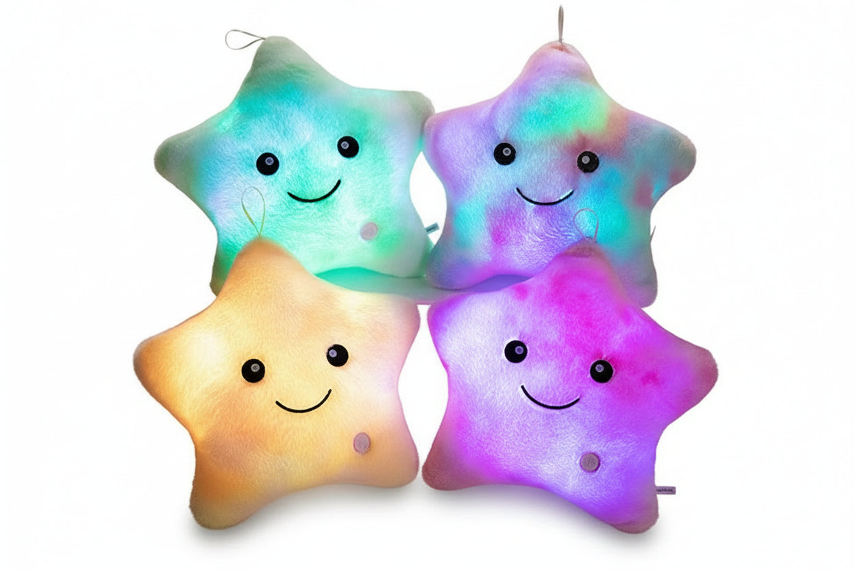 Four colorful star-shaped plush toys with smiling faces on a white background
