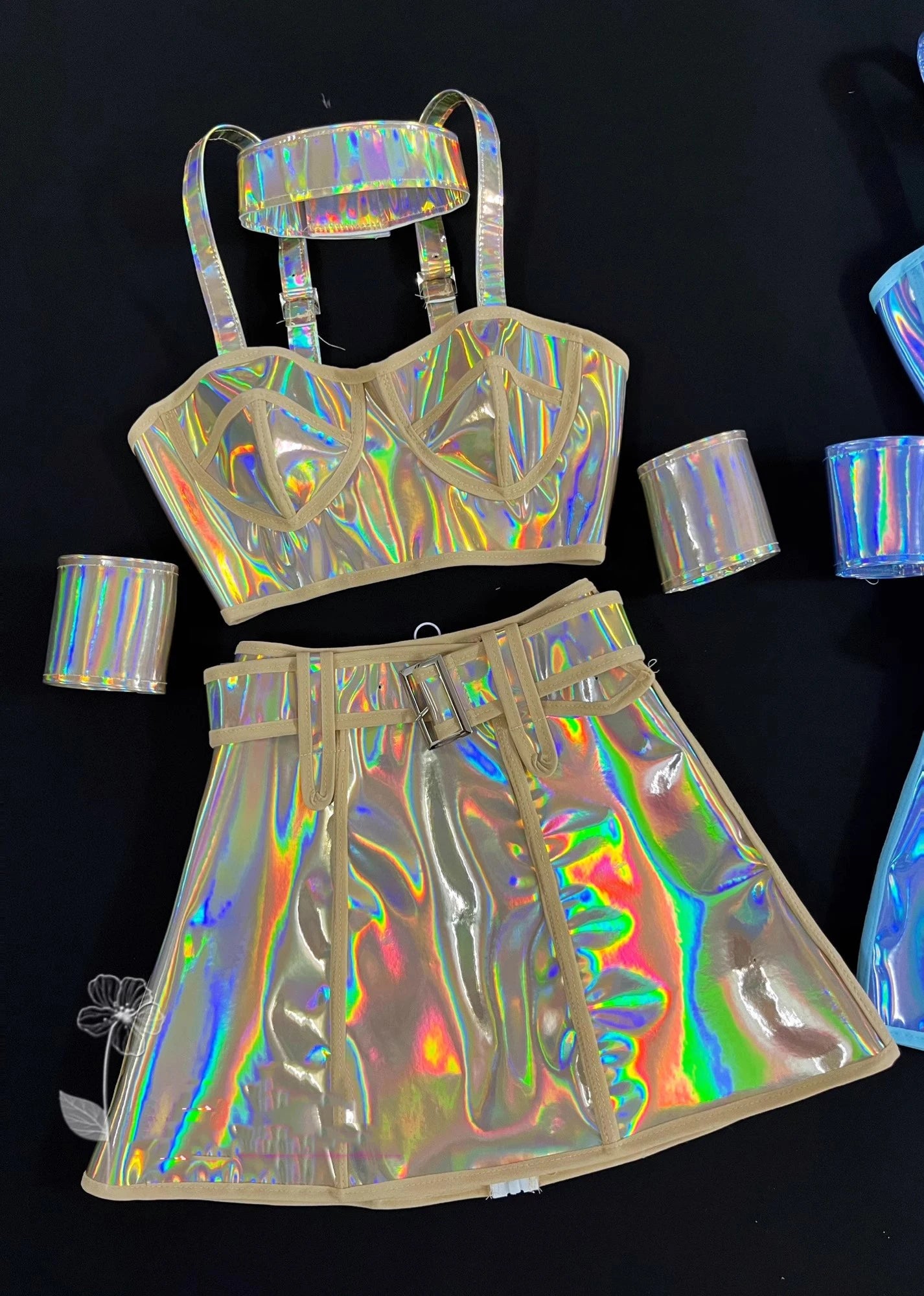 Holographic outfit with top and skirt on a black background