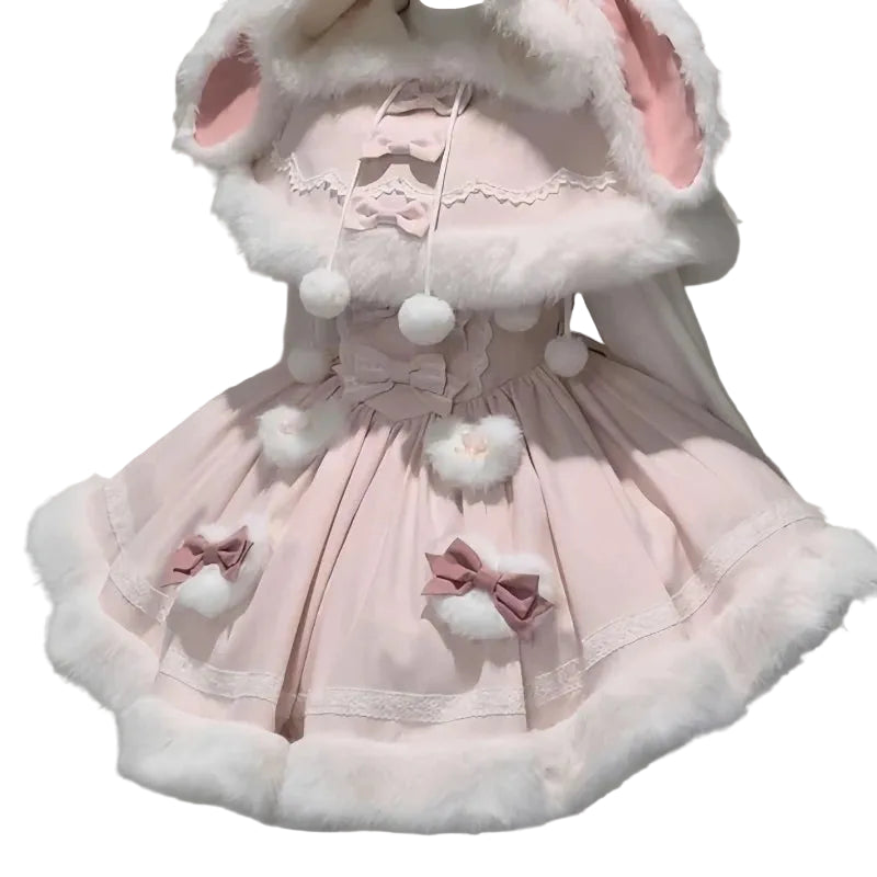 Pink dress with white fur trim and bunny ears on a neutral background