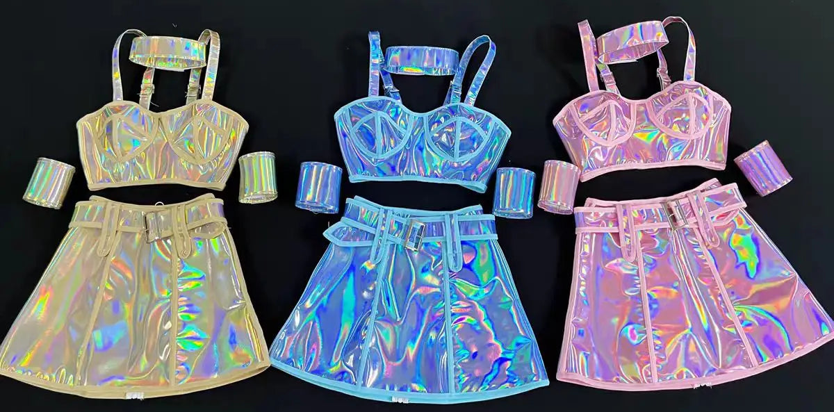 Three holographic outfits with top and skirt sets on a black background